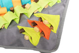 Dog trerats and food hiding in the polyster pockets on the messy mutts durable snuffle mat. 