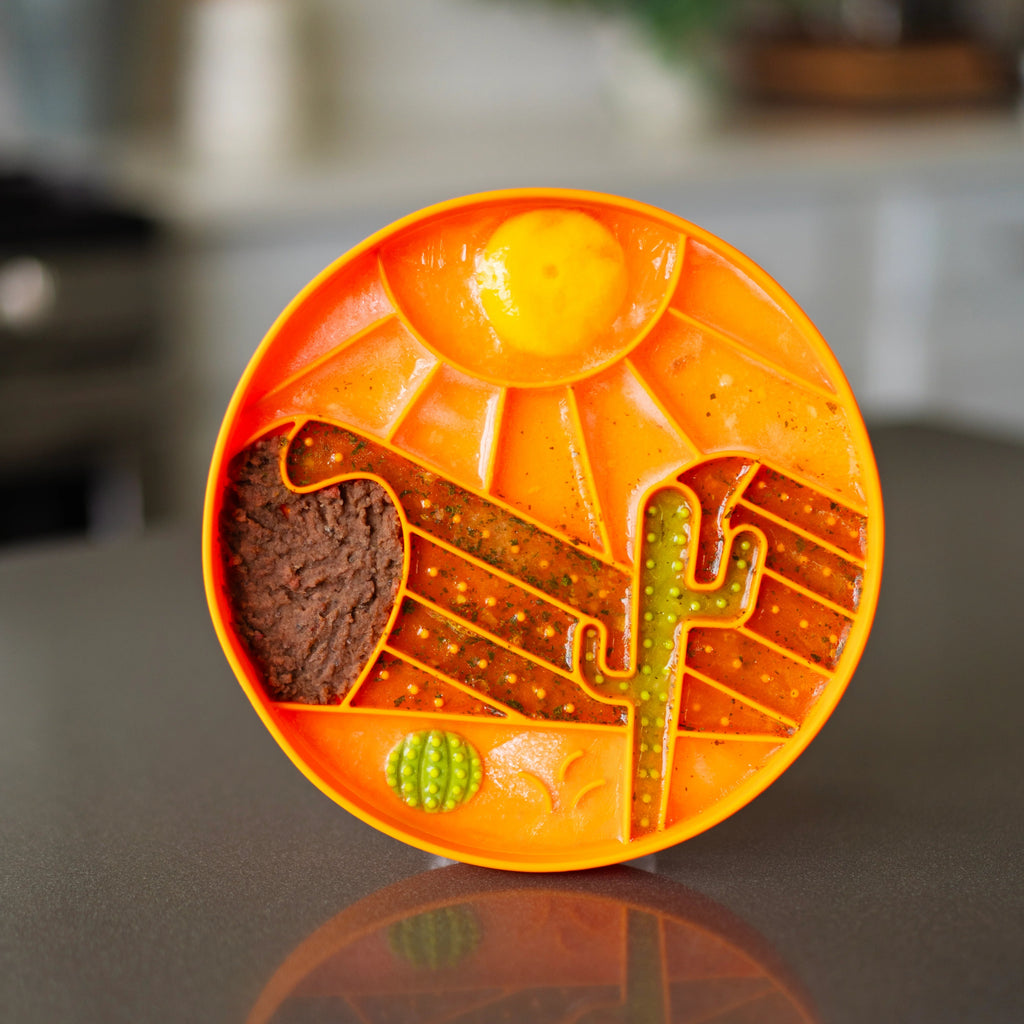 Orange lick bowl with food in it as the landscape.  Ideal for raw or dehydrated dog foods.