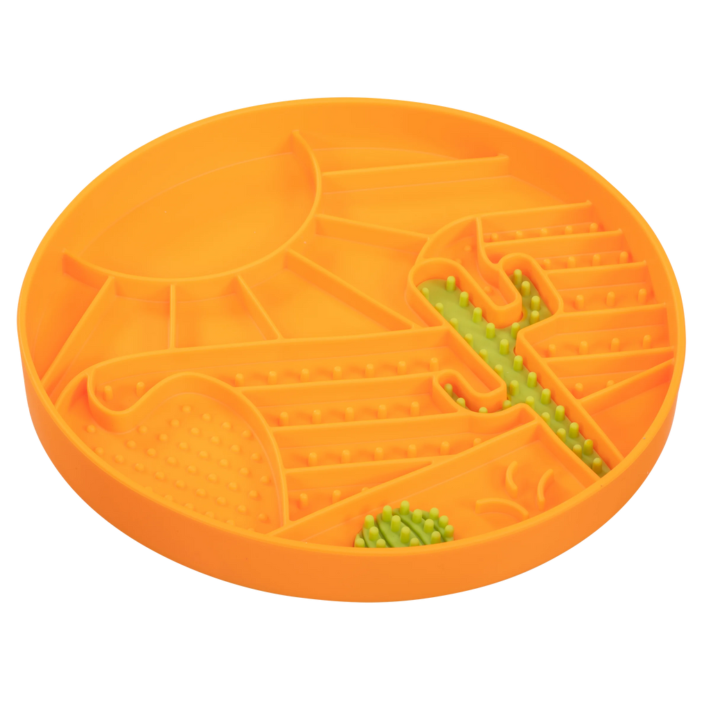 Orange Enrichment feeder for dogs with a desert theme with green cactus.