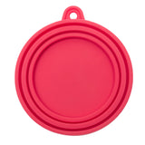 Red silicone cat food can cover that is air tight to keep food fresh.  