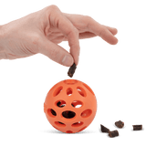 dog ball with holes also allows for treats to fall out when playing.  Perfect for engaging dog play. 